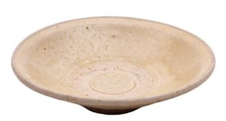 A Chinese pale celadon glazed dish: of shallow flared form with angler footrim, Song Dynasty, 17.