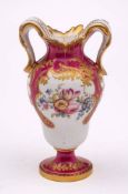 A mid 19th century English porcelain miniature vase: after the Sevres 'Vase a Oreilles' original,