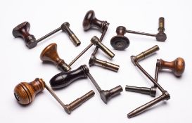 Eight longcase clock winding keys: of crank form with wooden handles.