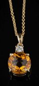 A citrine and diamond pendant,: the circular cut citrine in a four claw setting,