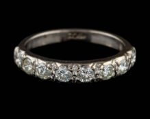 A diamond half eternity ring,: set with eight brilliant cut diamonds, approximately 0.