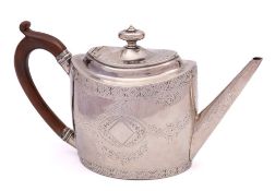 A George III silver teapot, maker Charles Hougham, London, 1792: of oval outline,