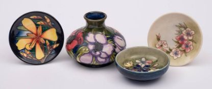 A small group of Moorcroft pottery: comprising a vase tube lined in the Anemone pattern,