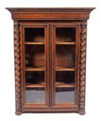 An oak and glazed bookcase in 17th century style, probably French, later 19th century,