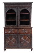 An Anglo-Indian hardwood, probably padouk and glazed cabinet bookcase, second quarter 19th century,