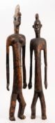 A pair of Lumbo (Gabon) carved wood figures: of a male and female, with incised decoration,