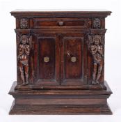 An Italian carved walnut side cabinet or armadietto, probably Umbria or Tuscany,