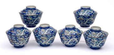 A set of six Chinese dragon cups and covers: each enamelled with two dragons pursuing flaming