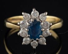 An 18 carat gold sapphire and diamond ring,