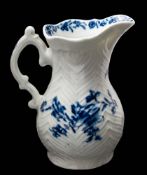 A First Period Worcester blue and white feather-moulded cream jug: of baluster form with double