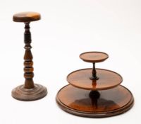 A 19th century rosewood three tier graduated stand: with turned knopped stem,