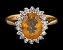 An 18 carat gold citrine and diamond ring,