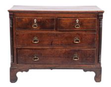 A George II oak chest of drawers,: mid 18th century, the top with moulded front and side edges,