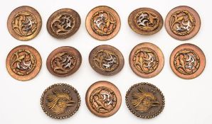 A group of eleven ornate polished bronzed metal buttons: with flower head and foliate decoration, 4.