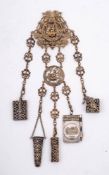 A late 19th century French gilded chatelaine: with pierced decoration of cherubs riding on the back