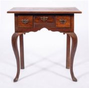 A George II oak and walnut lowboy, mid 18th century and later elements,