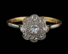 A diamond cluster ring,: set with brilliant cut diamonds, stamped 18ct plat, ring size O 1/2.