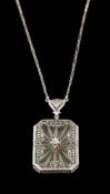 A rock crystal and diamond pendant,