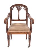 A Victorian oak library elbow chair in Gothic style, mid 19th century,