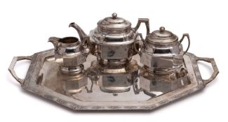 A silver three-piece tea service with matching tray, possibly Chinese,