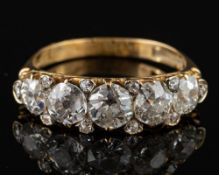 A diamond ring,: set with five old brilliant cut diamonds, approximately 1.