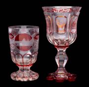 A Bohemian clear glass spa beaker and similar goblet: with cut and ruby flashed decoration,