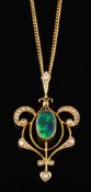 An Edwardian boulder opal doublet and seed pearl pendant,: circa 1905,
