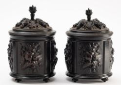 A pair of 19th century carton pierre tobacco jars and covers: of cylindrical outline,