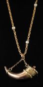 A gold coloured cornucopia pendant,: on a seed pearl set chain, stamped with French control marks.