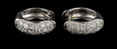 A pair of diamond hoop earrings,: set with brilliant cut diamonds, stamped 18k, with post fittings,