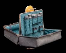 A late Victorian leather travelling vanity case: enclosing clear glass and silver mounted jars,