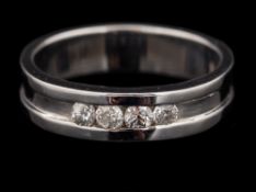 A 9 carat gold diamond ring,: the band set with four brilliant cut diamonds, stamped 375,