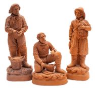A group of three French terracotta figures of fishermen: the bases incised 'Pecheur' and signed