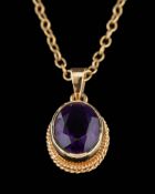 A 9 carat gold amethyst pendant,: the oval cut amethyst in a collet setting,