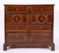 A Jacobean oak chest of drawers, circa 1680,: the top with moulded front and side edges,