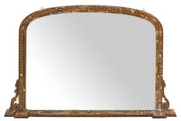 A Victorian giltwood and composition framed arched overmantel mirror, circa 1875,