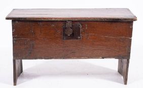 An oak six-plank coffer, first half 17th century,: the hinged cover with channel moulded edges,