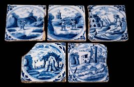 A group of five 18th century English blue and white delftware tiles: four of similar design