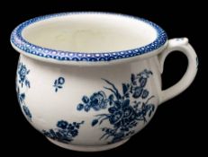 A First Period Worcester blue and white chamber pot: with turn-over rim and scroll handle,