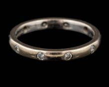 A diamond eternity ring,: set with brilliant cut diamonds,