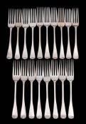 A matched set of eighteen silver table forks, various makers and dates: crested,
