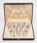 A set of twelve French silver liquor tots, stamped marks: of cylindrical tapering form,