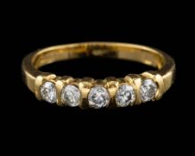 An 18 carat gold and diamond ring,: set with five brilliant cut diamonds, approximately 0.