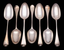 A collection of seven Georgian silver Hanoverian pattern tablespoons,
