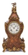 A Victorian French inlaid rosewood mantel clock: the eight-day duration movement striking the hours