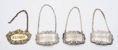 Three assorted silver spirit labels, various makers and dates: together with a plated example,