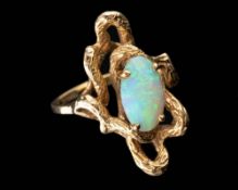 An opal ring,: the oval cabochon opal in a four claw setting, stamped 14k, ring size L.