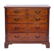 A George III mahogany chest of drawers, circa 1775,: the top with moulded front and side edges,