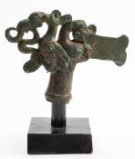 An oriental style bronze ceremonial axe head: decorated with a bird grasping a serpent and dragon's