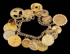 A charm bracelet,: the curb link bracelet with various charms, some gold.